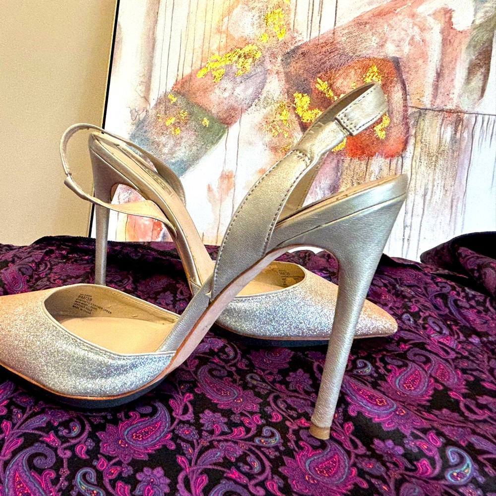 Gold leather slingback pumps.